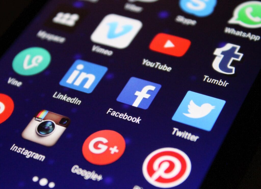 pexels photo 267350 Close-up of a smartphone screen showing various social media app icons such as Facebook and Twitter.